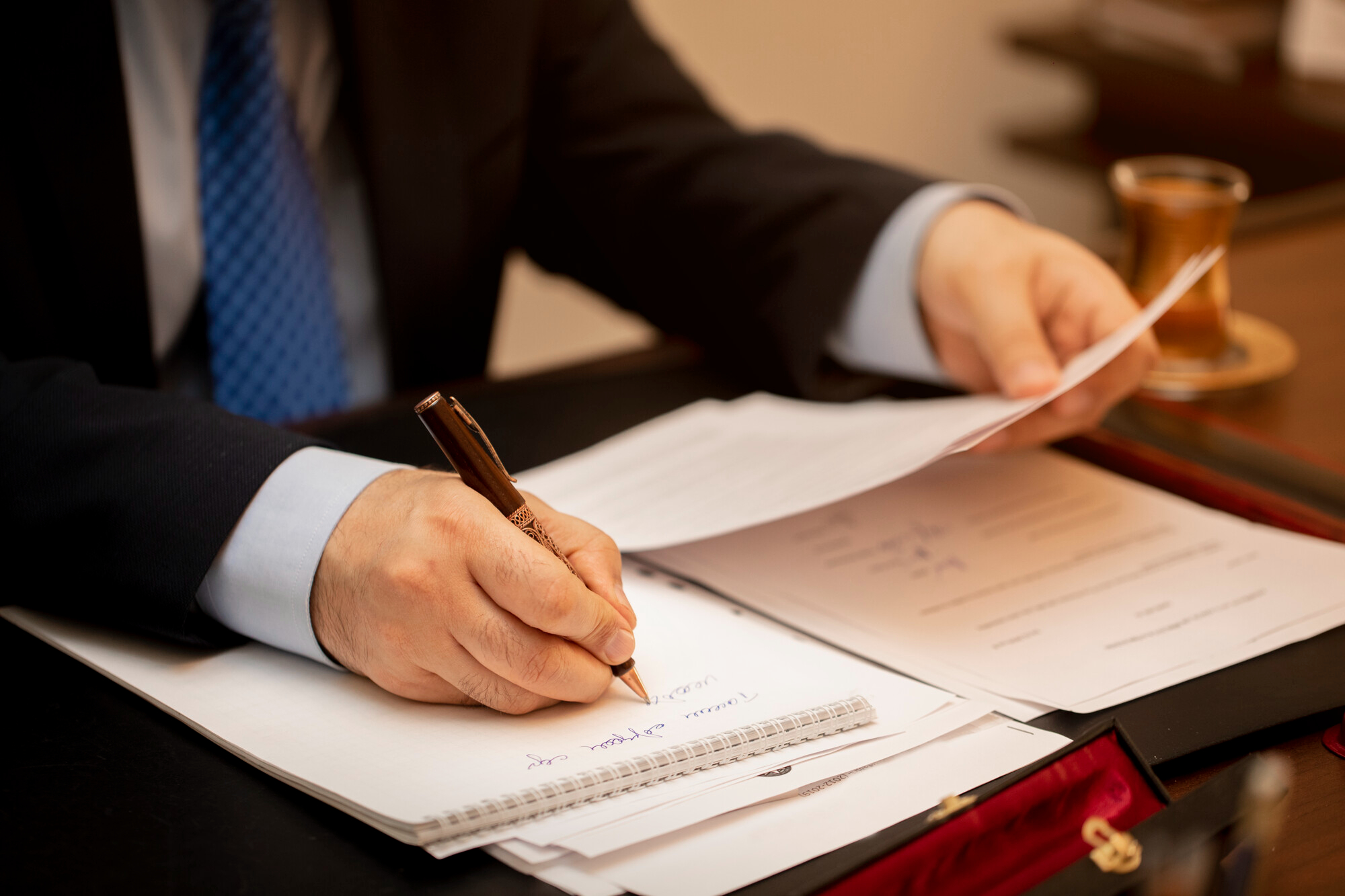 Businessman signing important contract papers Businessman signing important contract papers