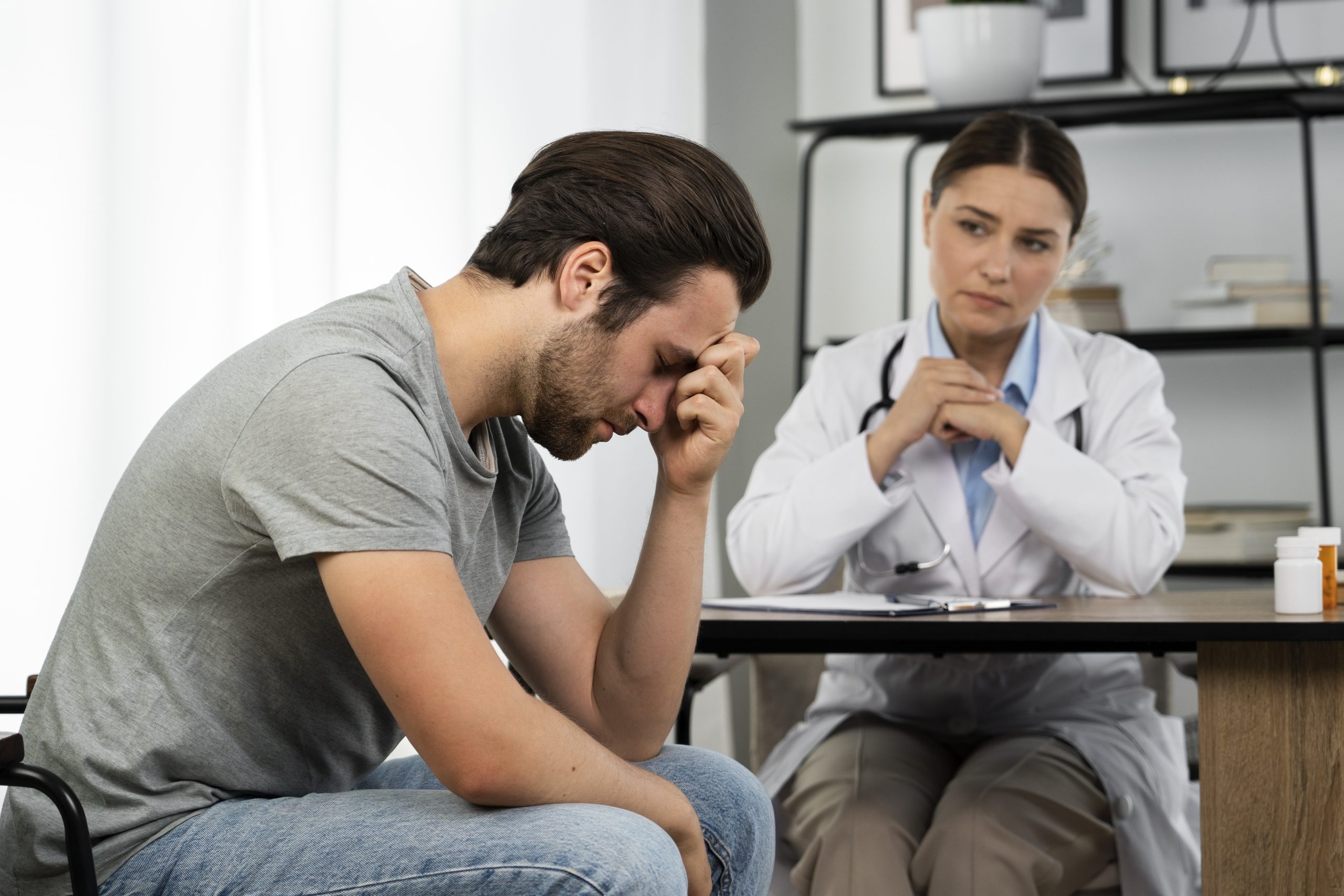 side-view-sad-man-doctor-s-appointment